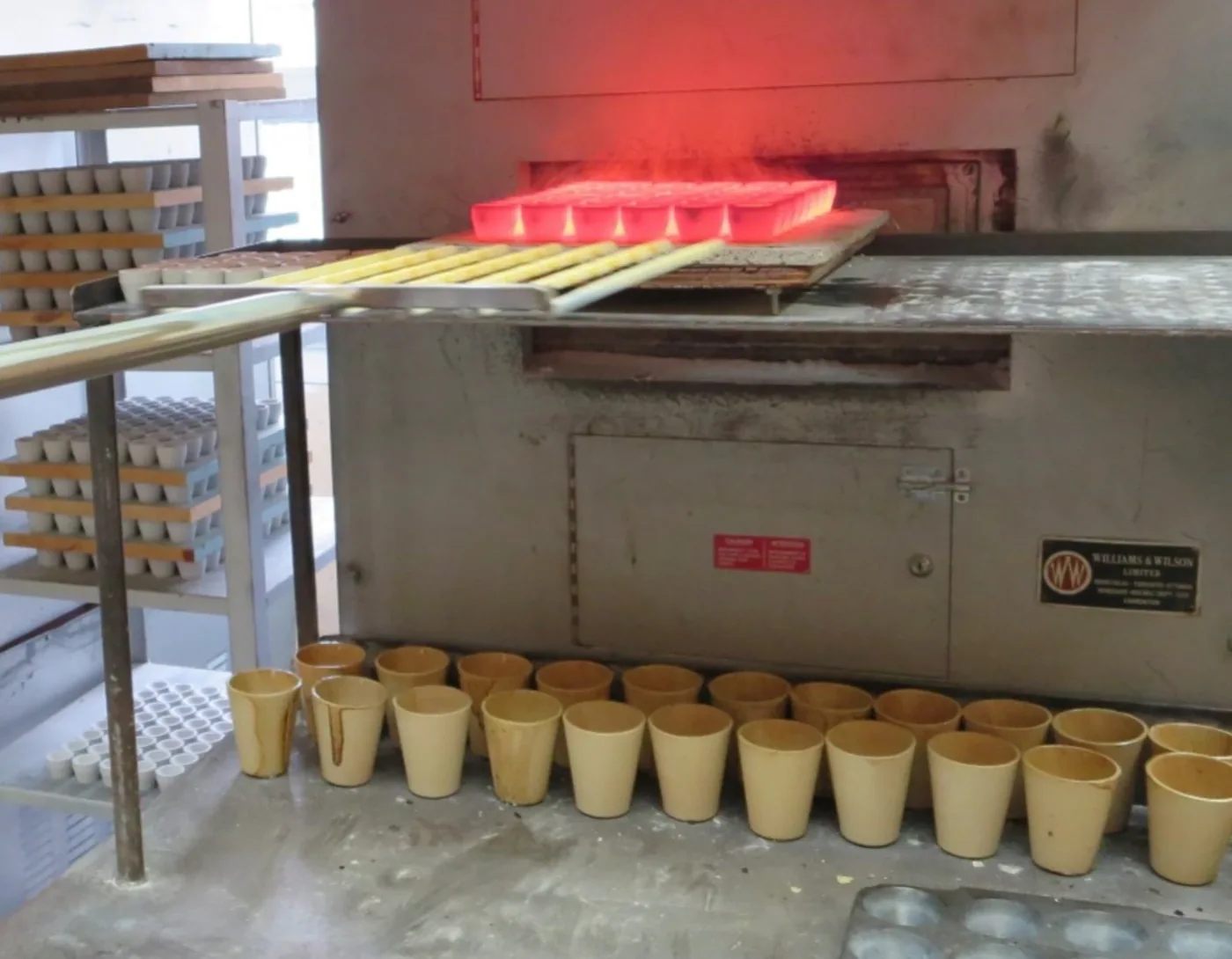 Glowing crucibles at the laboratory furnace.